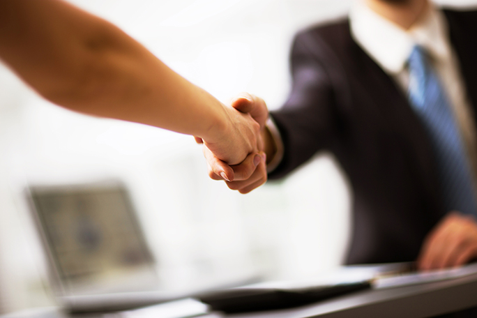 Business people shaking hands finishing up a meeting